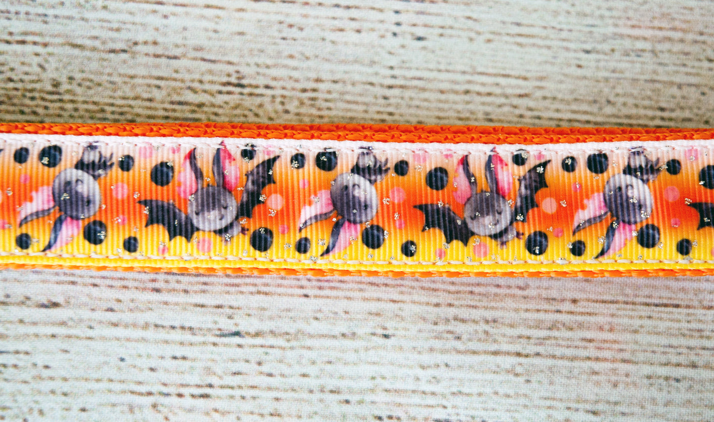 Cute little bat Halloween dog collar with a candy corn colored background. 1"wide