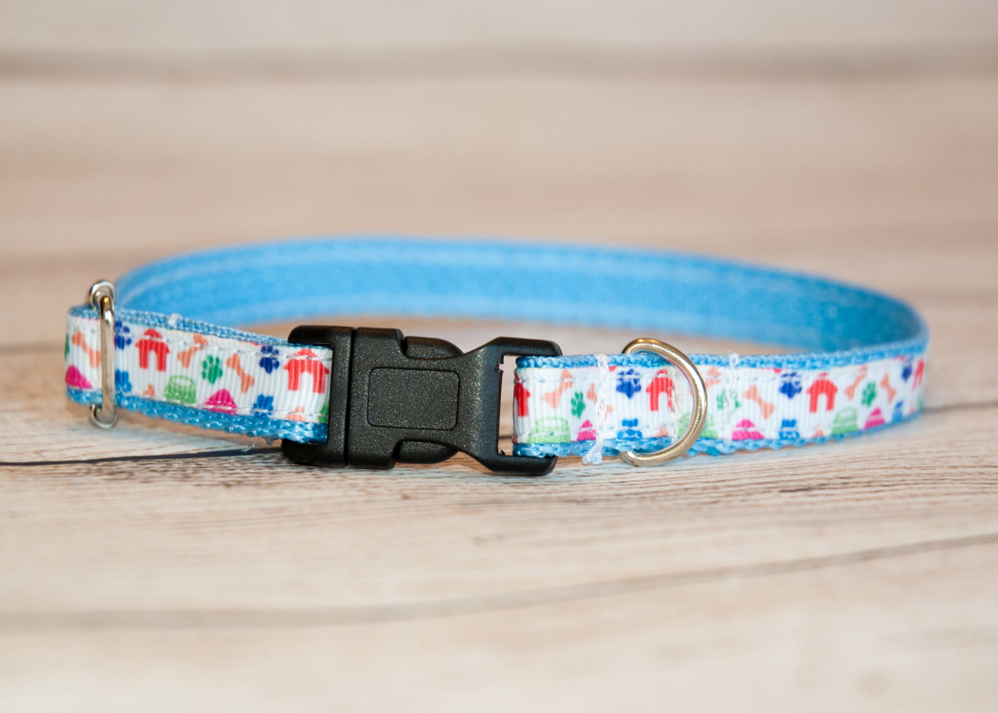 Dog houses, pawprints, and bones dog collar. 1/2" wide for small dogs or cats.