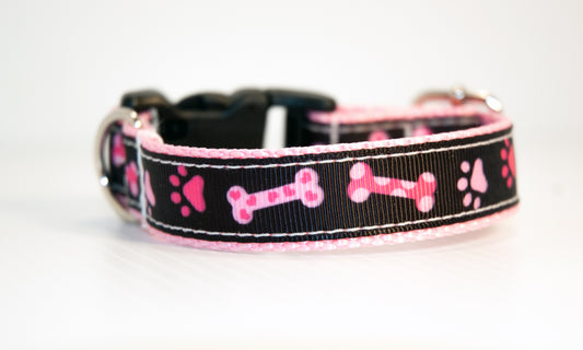 Pink Bones and Pawprints on black dog collar. 3/4 inch wide